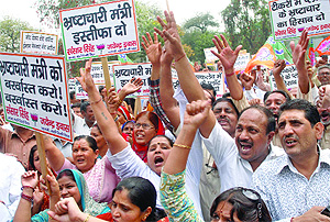 BJP activists shout slogans against the Delhi government near the Assembly in New Delhi on Friday.