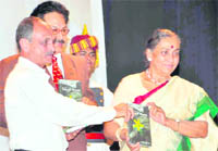 Governor Margaret Alva releases a book Floral Gallery of Himalayan Valley of Flowers and Adjacent Areas at the Raj Bhawan in Dehradun on Friday. 