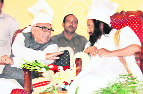 CM Bhupinder Singh Hooda and founder of the Art of Living Foundation Sri Sri Ravi Shankar at a programme in Rohtak on Thursday.