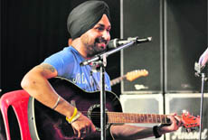 An artist performs at a Sufi rock concert at Gen Zorawar Singh auditorium in Jammu University.