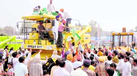 Farmers jostle to catch empty jute bags.