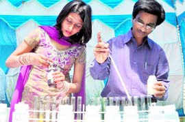 Experts test milk during the pashu palan mela at GADVASU in Ludhiana on Friday.