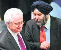 Russias UN Ambassador Vitaly Churkin (L) talks with Indias UN Ambassador Hardeep Singh Puri just before the United Nations Security Council vote on a Libya resolution calling for a no-fly zone, at the UN headquarters in New York