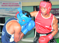 Boxers in action during a bout in the all India AK Mishra Memorial Boxing Championship being held at Skating Rink, Sector 10, Chandigarh