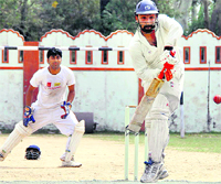 A batsman in action during a match of the District Cricket League played at the Survey Stadium in Dehradun 