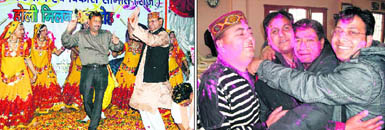 Uttarakhand Disaster Minister Khazan Dass dances at a Holi programme in Haridwar on Saturday; Members of the Press Club of Mussoorie hug one another on Saturday.