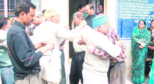 Members of Sankalp organisation greet one another at a Holi Milan programme in Dehradun on Saturday.