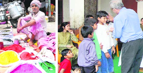 A colour vendor awaits customers at the Karna Gate market; and (above) local residents play 'tilak' Holi to motivate people to save water at the MDD Bal Bhawan orphanage in Karnal