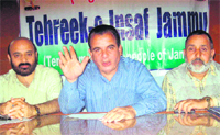 Mohd Farooq Mir, chairman of the Tehreek-e-Insaf, addresses a press conference in Jammu