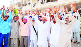 Farmers of Kotfatta village hold a protest outside the residence of Darshan Singh, an SAD leader, in Bathinda on Saturday.