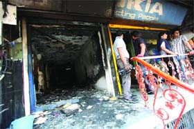 One of the shops at Chittaranjan Park in New Delhi that was burnt by a gang of robbers