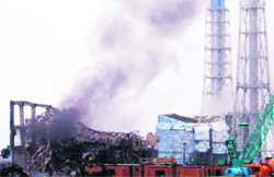A picture released by Tokyo Electric Power Company on Monday shows black smoke rising from reactor No. 3 of Fukushima Daiichi nuclear power plant at Okuma town. 