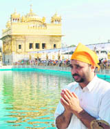 Comedian Bhagwant Mann pays obeisance at the Golden Temple in Amritsar on Tuesday.