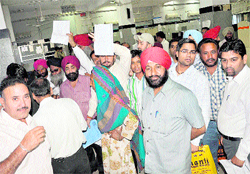 People harassed due to the strike in the Regional Passport Office in Sector 34, Chandigarh, on Tuesday