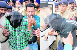 Sukhdev Singh, alias Billa, and Gurvinder Singh, alias Binder (masked faces), accused in the Khushpreet murder case being produced before District Courts in Sector 17, Chandigarh, on Tuesday