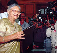 Sheila Dikshit poses for photographers before presenting the annual Budget in the Delhi Assembly on Tuesday.