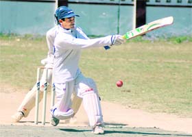 A batsman in action in the 59th District Cricket League at the Survey Stadium in Dehradun