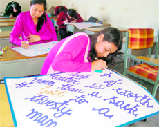 Students participate in a painting competition organised to celebrate World Water Day in Dharamsala on Tuesday