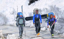 Canadian nationals - Alasdair Bates, Monte Painter and Madelene Martin Preney - near Kothi on the Manali-Rohtang road after returning from their ski tour in Marhi. 