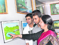 Hemant Lata Nair, a fingertip painter, with her creations.