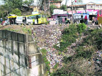 A garbage dump on a road in Baijnath.