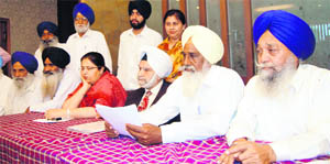 Residents of Kot Khalsa village address mediapersons in Amritsar on Tuesday.