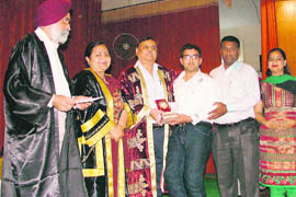 Rahul Duggal receives a prize during the annual prize distribution function of SCD Government College, Ludhiana, on Tuesday.