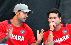 Sachin Tendulkar (R) listens to captain M S Dhoni during a training session at The Sardar Patel Stadium, Motera in Ahmedabad on Tuesday.