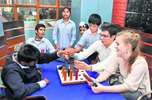 Getting interactive: foreign students spend time with special children