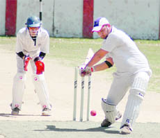 A batsman in action during a match of the 59th District Cricket League at the Survey of India Stadium in Dehradun on Wednesday.