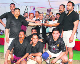 The Security A team with the winners trophy of the ONGC Inter-Departmental Volleyball Tournament in Dehradun on Wednesday.