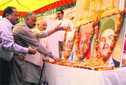 BJP leaders pay floral tributes to Shaheed Bhagat Singh, Sukhdev and Rajguru at a Shaheedi Diwas function in Jammu on Wednesday