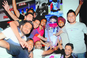 Cricket buffs in Chandigarh celebrate Indias victory over Australia during the quarterfinals of the ICC World Cup on Thursday. 