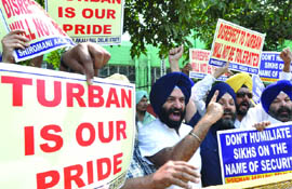 Actvists of the Shiromani Akali Dal, Delhi unit, shout slogans against the removal of the turban of golfer Amritinder Singh at Milan airport outside the embassy of Italy in New Delhi on Thursday.
