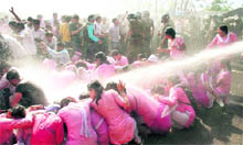 The Dehradun police uses water cannons to disperse agitating BTC-trained teachers near the state Assembly in Dehradun on Thursday. 