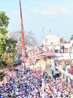 Lakhs of devotees at the Guru Ram Rai Darbar Sahib converge to hoist the Jhanda Sahib in Dehradun on Thursday. 