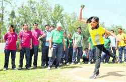 A student takes part in the shot put event at the annual sports meet of the Forest Research Institute in Dehradun on Thursday. 