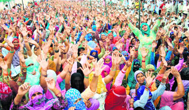 Activists of the Akhil Bharatiya Jat Aarakshan Sangharsh Samiti block the Hisar-Rewari rail track at Mayyar village in Hisar on Thursday.