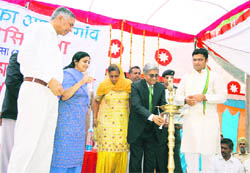 SBI Deputy Managing Director Diwakar Gupta launches the SBI ka Apna Gaon scheme at Madhosinghana in Sirsa. MP Ashok Tanwar and DC YS Khyalia are also seen 