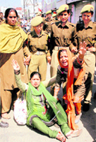 Protesters shout slogans in support of their demands