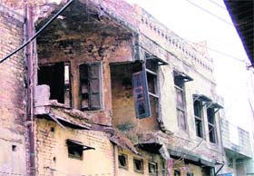 A three-storeyed dilapidated building at Chhawani Mohalla in old city