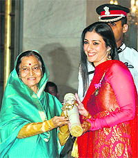 President Pratibha Patil presents the Padma Shri award to Bollywood actor Tabu at a function in New Delhi on Thursday.