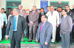 Justice Altamash Kabir (red tie), judge of the Supreme Court, with Chief Justice Barin Ghosh (blue tie), Nainital High Court, at the inauguration of a mega Lok Adalat in Dehradun on Friday.