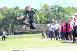 A student participates in the long-jump event of the 10th Annual Sports Meet of the FRI University in Dehradun on Friday.