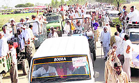 Jat protesters arrive at Ramayan village from nearby areas in Hisar on Friday to resist a possible eviction from rail tracks following High Court orders.