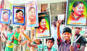 Young AIADMK supporters wait for party supremo J Jayalalithaa at an election campaign rally for the upcoming Tamil Nadu Assembly election in Tiruchirapalli on Thursday