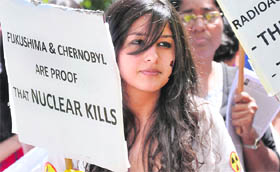 WE DONT WANT A REPEAT OF JAPAN: Greenpeace activists protest against setting up of a nuclear plant at Jaitapur (Maharashtra) in New Delhi on Friday.
