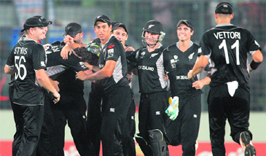 New Zealand players celebrate the dismissal of South Africas Johan Botha in Dhaka on Friday. New Zealand won by 49 runs