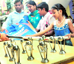 People buy replicas of the World Cup trophy in Sector 20, Chandigarh. Each replica is being sold for Rs 500 and the price is rising