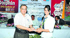 A student being honoured at the orientation programme organised by the Dolphin Institute in Dehradun on Saturday.
